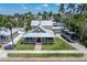 Attractive exterior view of a two-story home with a wrap-around porch and well-maintained landscaping at 110 Gilchrist St, Punta Gorda, FL 33950