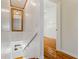 Hallway area featuring wood paneling, wood stairs and views into the bedroom at 110 Gilchrist St, Punta Gorda, FL 33950