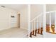 Bright hallway with hardwood floors and doorway to an additional room with built in shelves at 110 Gilchrist St, Punta Gorda, FL 33950