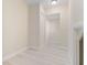Hallway area featuring light hardwood flooring and neutral colored walls at 110 Gilchrist St, Punta Gorda, FL 33950