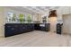 Beautiful kitchen with black and white cabinets, stainless steel appliances, and a decorative ceiling at 110 Gilchrist St, Punta Gorda, FL 33950