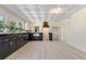 Well-appointed kitchen with stylish black lower cabinets, white upper cabinets, and a unique textured ceiling at 110 Gilchrist St, Punta Gorda, FL 33950