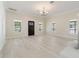 Inviting living room featuring light wood floors, a decorative fireplace, and an abundance of natural light at 110 Gilchrist St, Punta Gorda, FL 33950