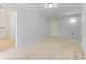 View of a room with wood-look tile floors and light gray walls with doorways and an open closet at 110 Gilchrist St, Punta Gorda, FL 33950