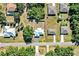 Overhead aerial view of home featuring well-manicured lawn and spacious driveway at 1210 Marlow St, Port Charlotte, FL 33952