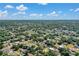 Expansive aerial view of the neighborhood showcasing lush greenery and scattered homes at 1210 Marlow St, Port Charlotte, FL 33952