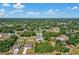 Wide aerial view showcasing the home's location within a lush, green neighborhood at 1210 Marlow St, Port Charlotte, FL 33952