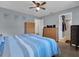 Comfortable bedroom with two dressers, ceiling fan and modern decor at 1210 Marlow St, Port Charlotte, FL 33952