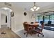 Cozy dining area features a round table, tiled floors, and lots of natural light at 1210 Marlow St, Port Charlotte, FL 33952