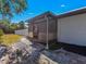 Covered lanai with stone patio, perfect for outdoor relaxation and entertaining at 1210 Marlow St, Port Charlotte, FL 33952