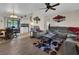 Comfortable living room area with hardwood floors, modern furnishings, and neutral color scheme at 1210 Marlow St, Port Charlotte, FL 33952