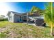 Enjoy the outdoor patio area with nice seating and a grill, great for entertaining at 13449 Muriel Ave, Port Charlotte, FL 33981