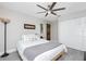 A well-lit bedroom features neutral decor, wood floors and modern lighting at 13449 Muriel Ave, Port Charlotte, FL 33981