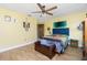 Bright bedroom featuring wood floors and colorful decor at 13449 Muriel Ave, Port Charlotte, FL 33981