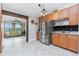 Kitchen featuring stainless steel appliances, dark backsplash, and adjacent living space at 13449 Muriel Ave, Port Charlotte, FL 33981