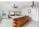 Open-concept kitchen featuring granite counters, a central island, and stainless steel appliances at 13449 Muriel Ave, Port Charlotte, FL 33981