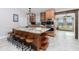The chef's kitchen boasts of stainless appliances, a sizable granite island, and custom cabinetry at 13449 Muriel Ave, Port Charlotte, FL 33981