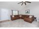 The living area features sleek tiled flooring and comfortable seating for relaxing and entertaining at 13449 Muriel Ave, Port Charlotte, FL 33981