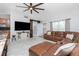 Inviting living room with a large TV, comfortable seating, and ample natural light at 13449 Muriel Ave, Port Charlotte, FL 33981