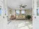 Bright sunroom with neutral decor, multiple windows, and comfortable seating at 13449 Muriel Ave, Port Charlotte, FL 33981