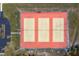 Aerial view of tennis courts with three courts in a well-maintained community setting at 13449 Muriel Ave, Port Charlotte, FL 33981