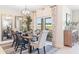 Dining area featuring modern lighting, contemporary decor, and a view of the screened in lanai at 1419 Powell Valley Dr, Port Charlotte, FL 33953
