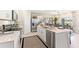Well-equipped kitchen featuring stainless steel appliances, granite countertops, and a large island at 1419 Powell Valley Dr, Port Charlotte, FL 33953