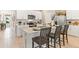 Modern kitchen featuring white cabinetry, stainless steel appliances, an island with bar seating at 1419 Powell Valley Dr, Port Charlotte, FL 33953