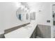 Bright bathroom featuring a gray vanity, unique lighting, and plenty of counter space at 1756 Elinor Pl, Englewood, FL 34223