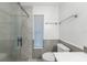 Bathroom featuring modern shower with tiled walls, and gray paneled trim at 1756 Elinor Pl, Englewood, FL 34223