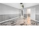 Bedroom featuring tiled floors, a fan, closet and entry door at 1756 Elinor Pl, Englewood, FL 34223