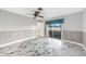 Bedroom with tiled floors, fan, and sliding glass doors to screened porch at 1756 Elinor Pl, Englewood, FL 34223