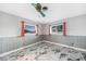 Bedroom with tiled floors, fan, and bright windows at 1756 Elinor Pl, Englewood, FL 34223