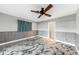 Bedroom with tiled floors, fan, and window view at 1756 Elinor Pl, Englewood, FL 34223