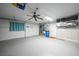 View of a two car garage with washer/dryer unit, water heater, and tool bench at 1756 Elinor Pl, Englewood, FL 34223