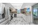 Modern kitchen with stainless steel appliances and grey cabinets at 1756 Elinor Pl, Englewood, FL 34223