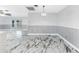 Open living area with large windows and marble floors at 1756 Elinor Pl, Englewood, FL 34223