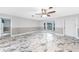 Inviting living room featuring a bay window and stylish marble flooring at 1756 Elinor Pl, Englewood, FL 34223