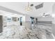 Open-concept living space with a view of the kitchen and sunroom at 1756 Elinor Pl, Englewood, FL 34223