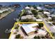 Waterfront home with a metal roof, dock, and waterfront access on a picturesque canal at 187 Beeney Se Rd, Port Charlotte, FL 33952