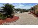 Waterfront property featuring lush landscaping, dock access, and a serene backyard setting perfect for outdoor enjoyment at 187 Beeney Se Rd, Port Charlotte, FL 33952