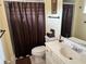 Bathroom featuring a shower/tub combo, single sink vanity and neutral color palette at 187 Beeney Se Rd, Port Charlotte, FL 33952