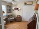 Comfortable bedroom featuring a sitting area with a ship model and closet at 187 Beeney Se Rd, Port Charlotte, FL 33952