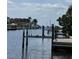 Dock on the canal, equipped with a boat lift and providing direct access to the waterway at 187 Beeney Se Rd, Port Charlotte, FL 33952