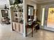 Elegant foyer featuring tiled floors, decorative shelves, and ample space for welcoming guests at 187 Beeney Se Rd, Port Charlotte, FL 33952