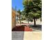 Landscaped front yard with mature trees, rock beds, and well-maintained greenery enhancing curb appeal at 187 Beeney Se Rd, Port Charlotte, FL 33952