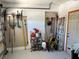 Organized garage storage with various tools and equipment neatly arranged on shelves and racks at 187 Beeney Se Rd, Port Charlotte, FL 33952