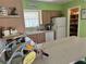 Bright kitchen with an open pantry, lots of cabinets, and a breakfast bar at 187 Beeney Se Rd, Port Charlotte, FL 33952