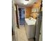 Functional laundry room with washer, dryer, water heater, and storage space, offering convenience at 187 Beeney Se Rd, Port Charlotte, FL 33952