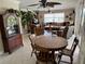 Expansive living area with dining table, ceiling fans, and ample seating, great for entertaining at 187 Beeney Se Rd, Port Charlotte, FL 33952